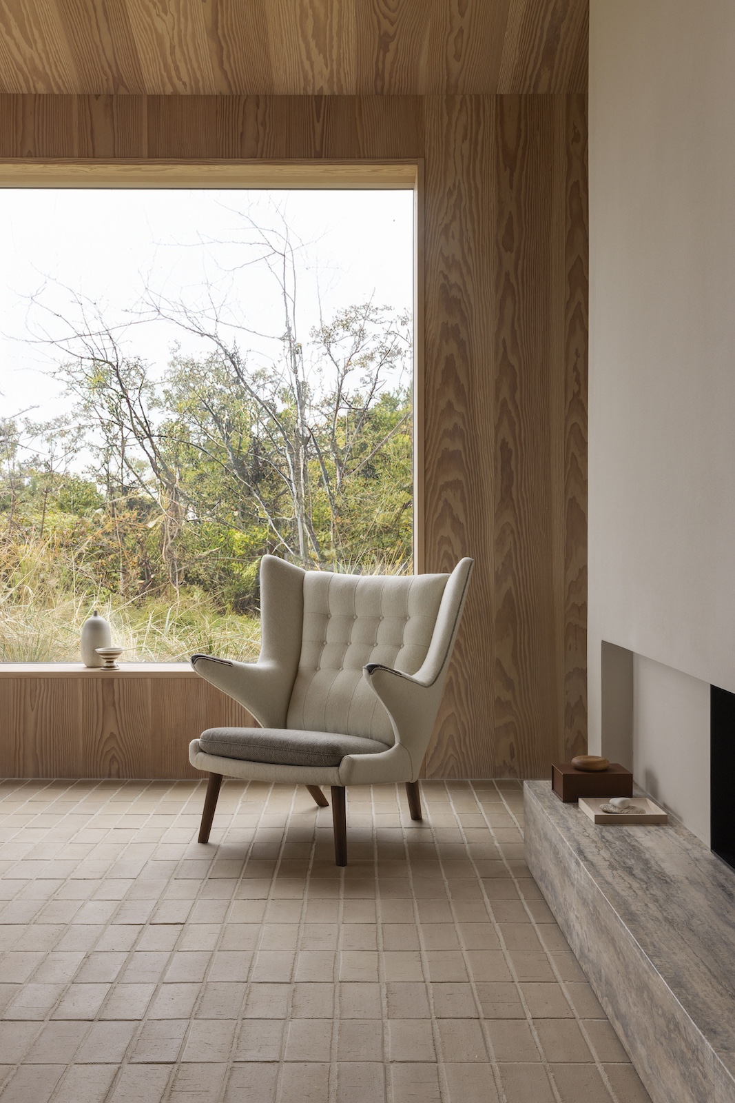 pp19 Papa Bear Chair beside Fireplace